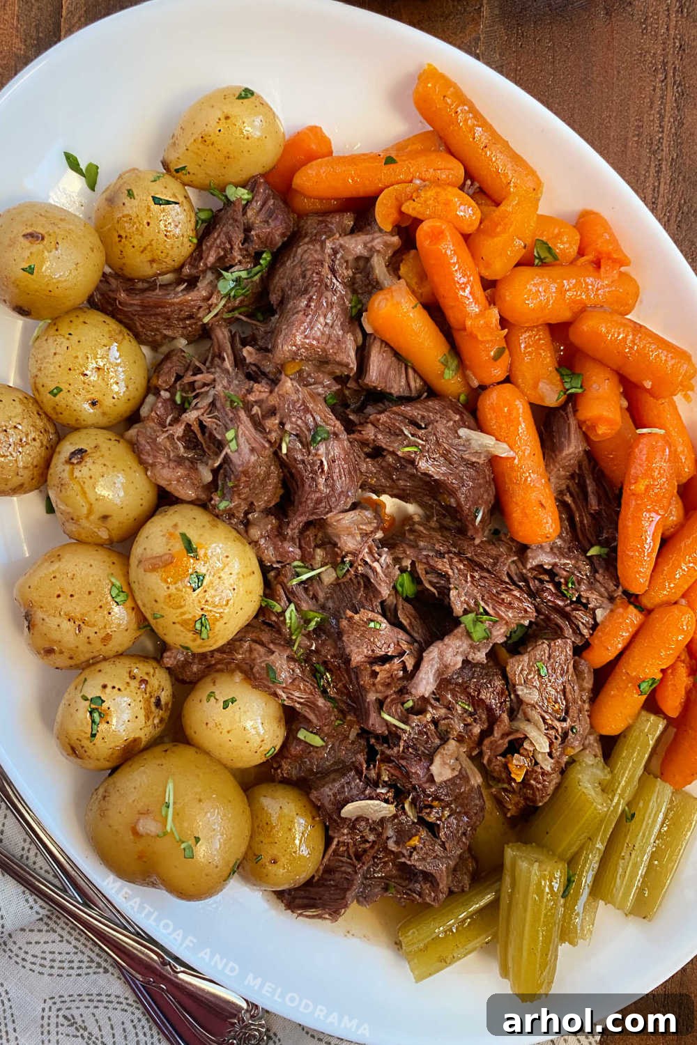 Delicious Instant Pot Pot Roast with onion soup mix, beef chuck roast, potatoes, and carrots served on a platter