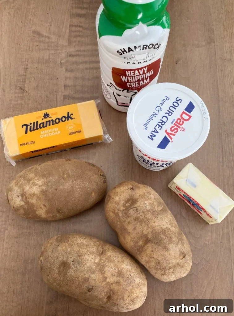 A vibrant flat lay image showcasing all the fresh and simple ingredients required for making the twice baked mashed potato casserole, neatly arranged on a rustic wooden surface.
