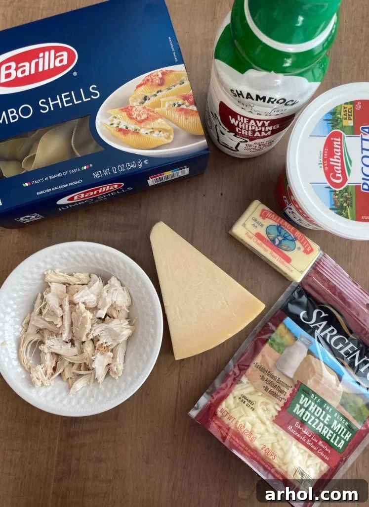 jumbo pasta shells, cream, ricotta butter, parmesan, mozzarella and cooked chicken on the table