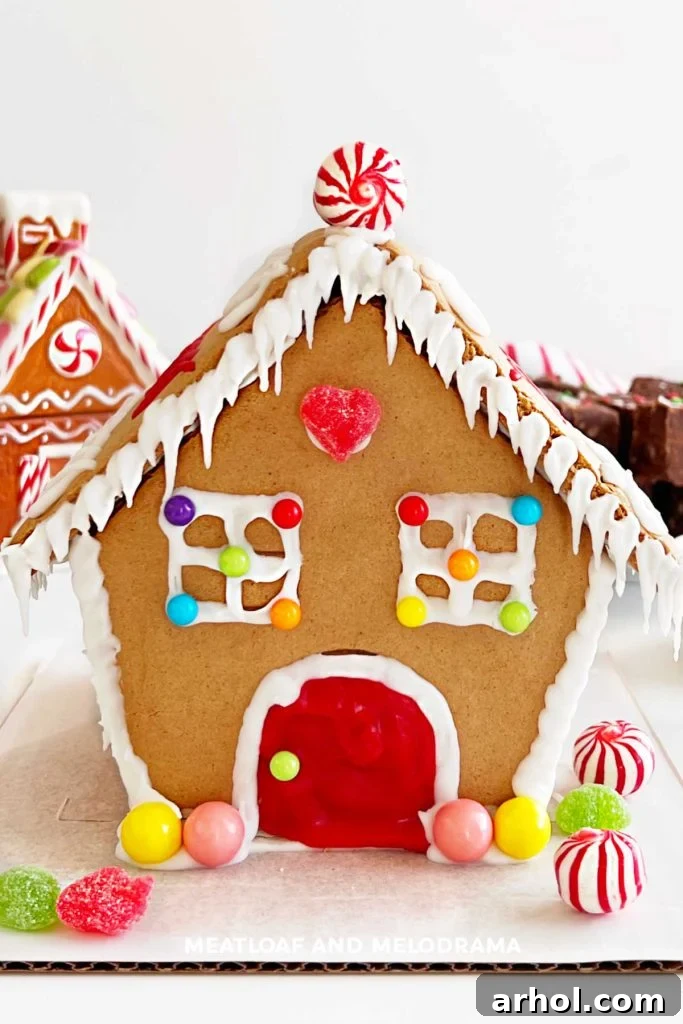 Beautifully decorated gingerbread house with colorful candies and frosting