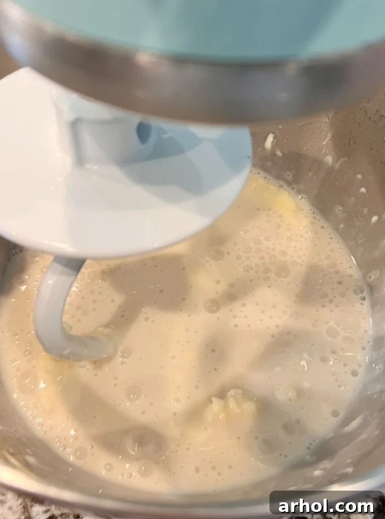 yeast, butter, milk and sugar in stand mixer