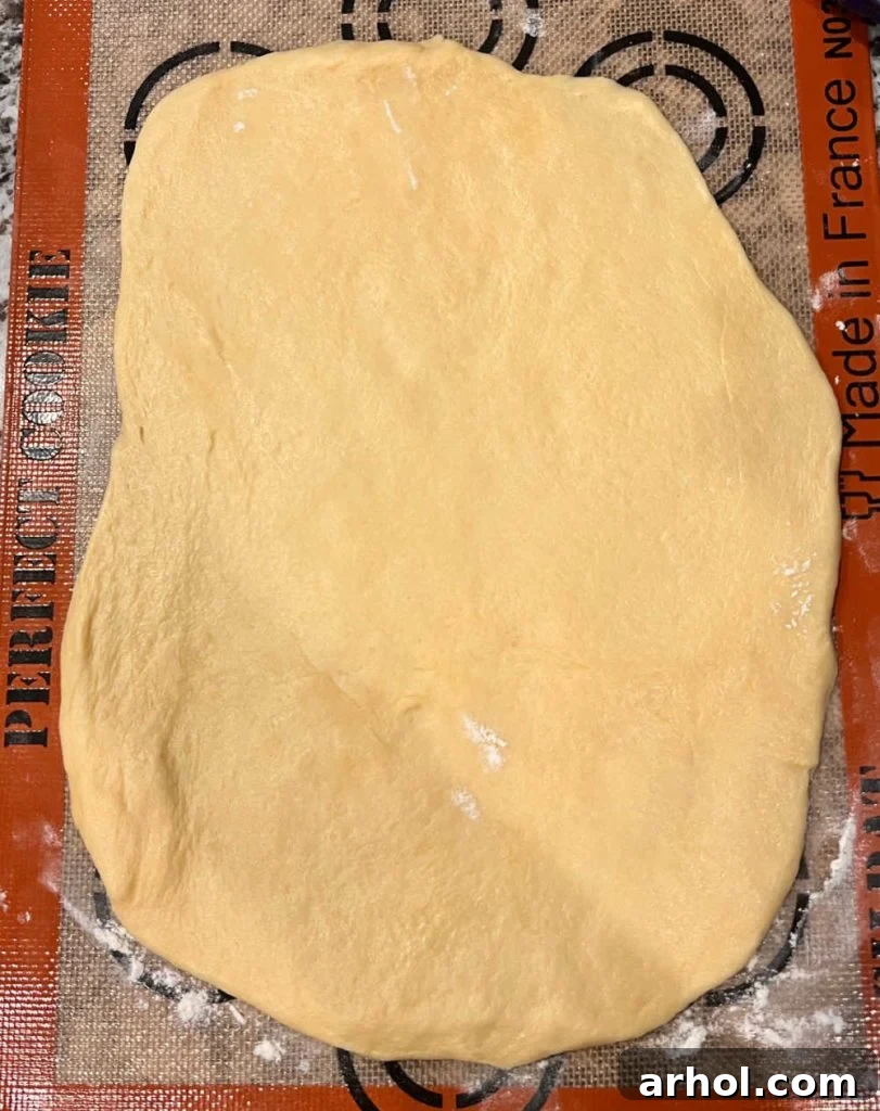 dough rolled 12 x 10 and 1/4 inch thick on silicone mat