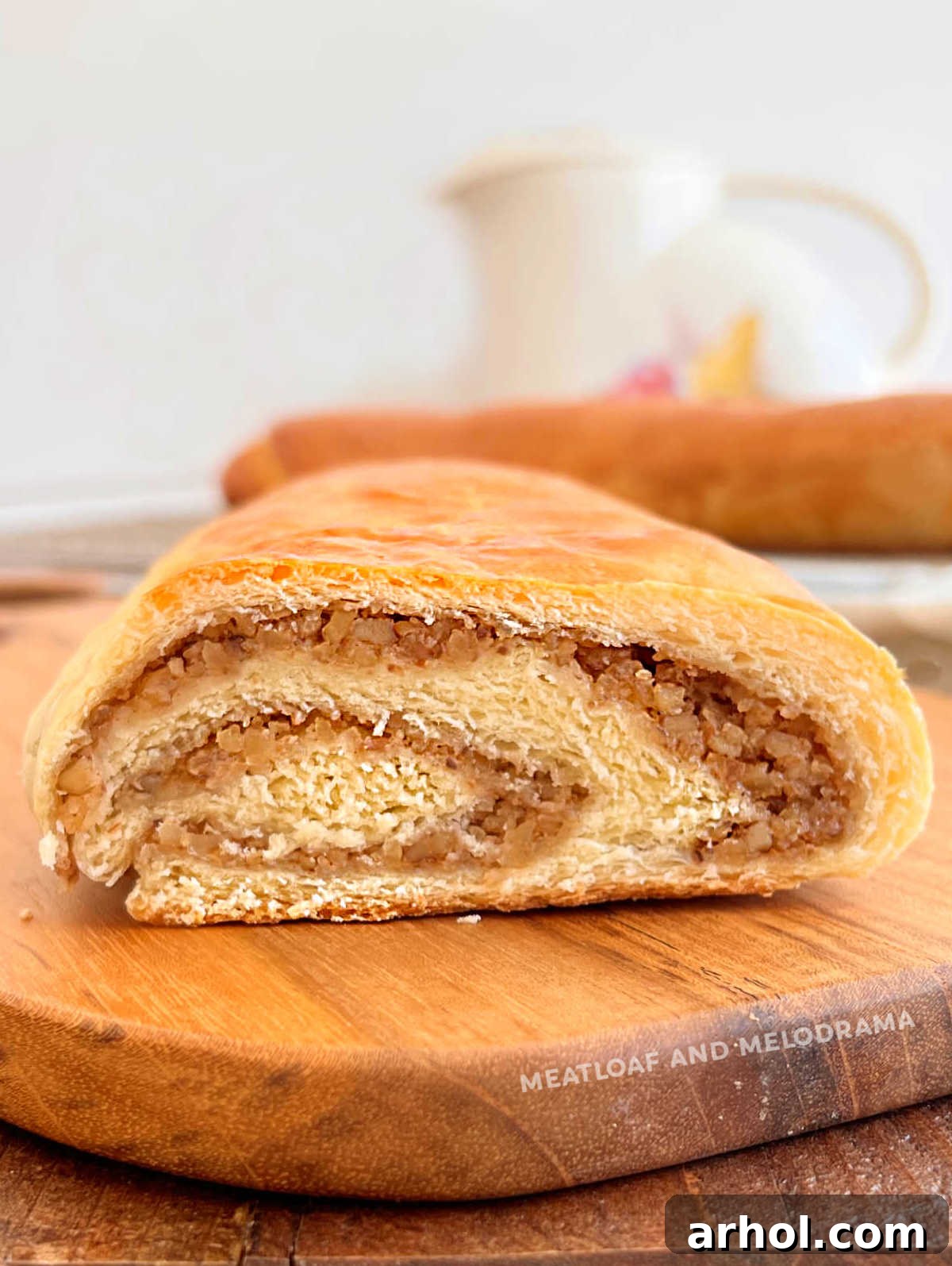 cut nut roll with swirled walnut filling on the table