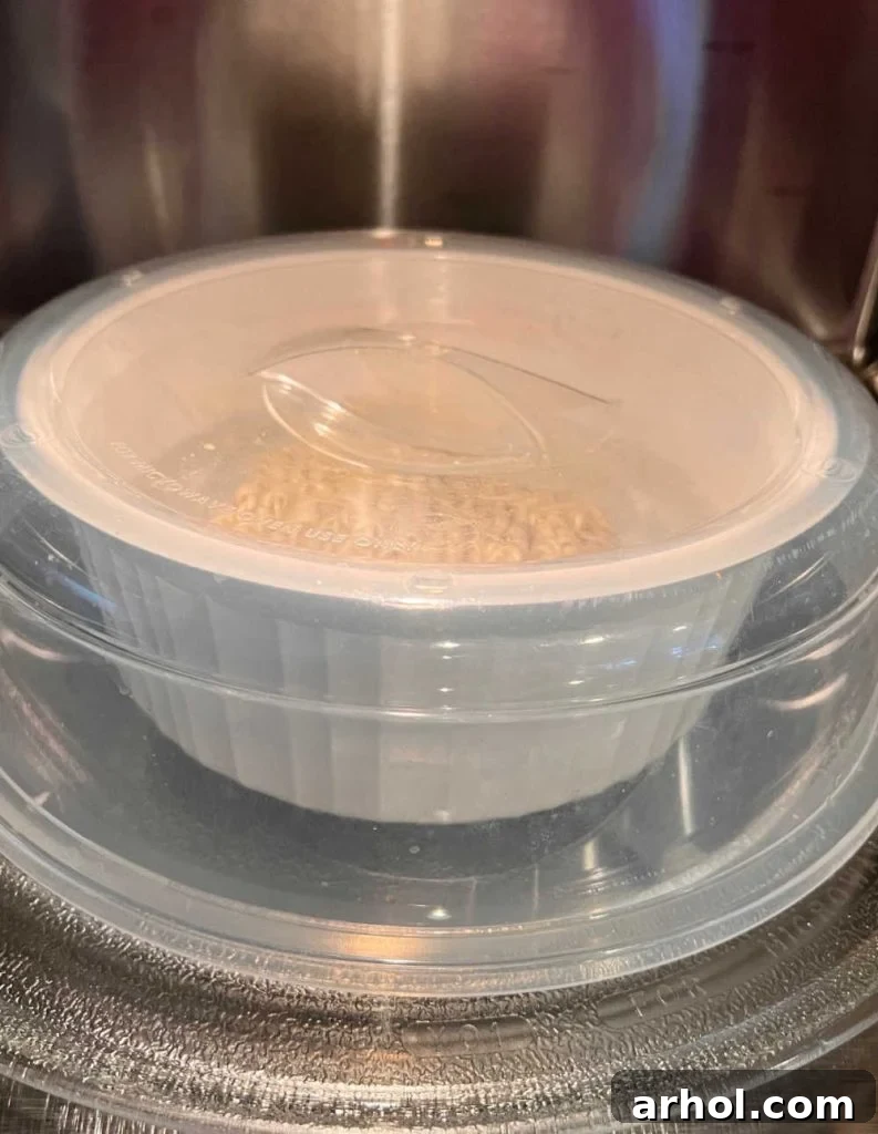bowl of ramen in microwave under cover