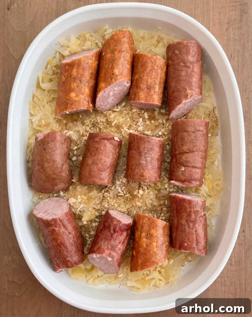 Smoked sausage over sauerkraut in baking dish