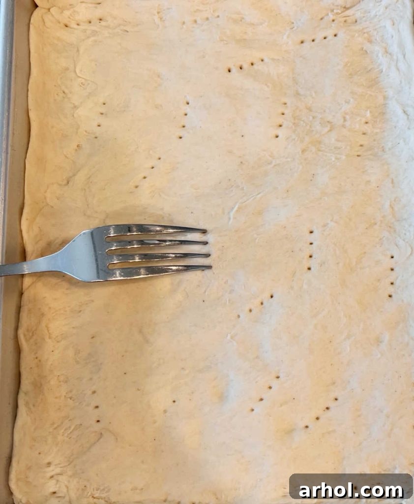 poke holes in pizza crust with fork
