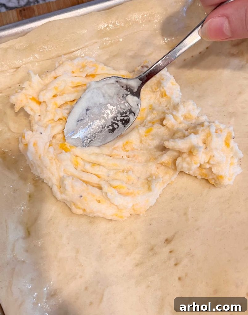 spread cheese mash potatoes on pizza crust