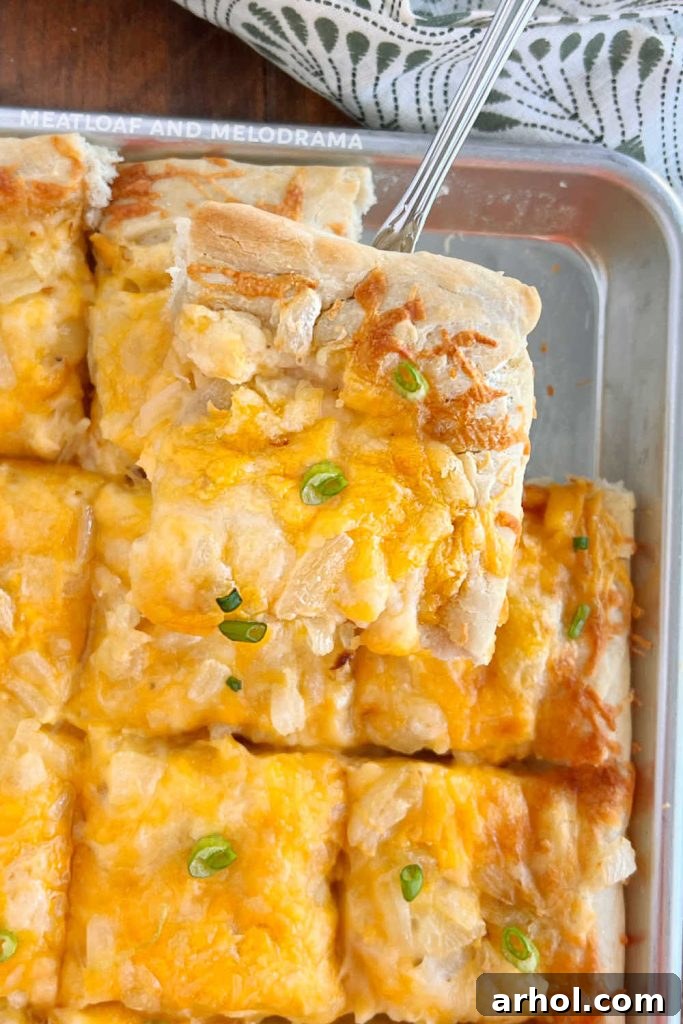 slice of pierogi pizza on spatula