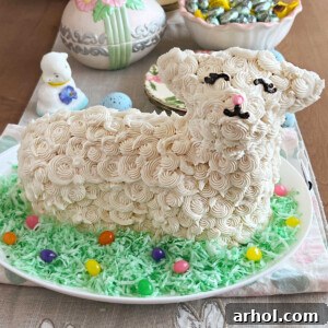 easter lamb cake decorated with buttercream frosting, colored coconut and jelly beans