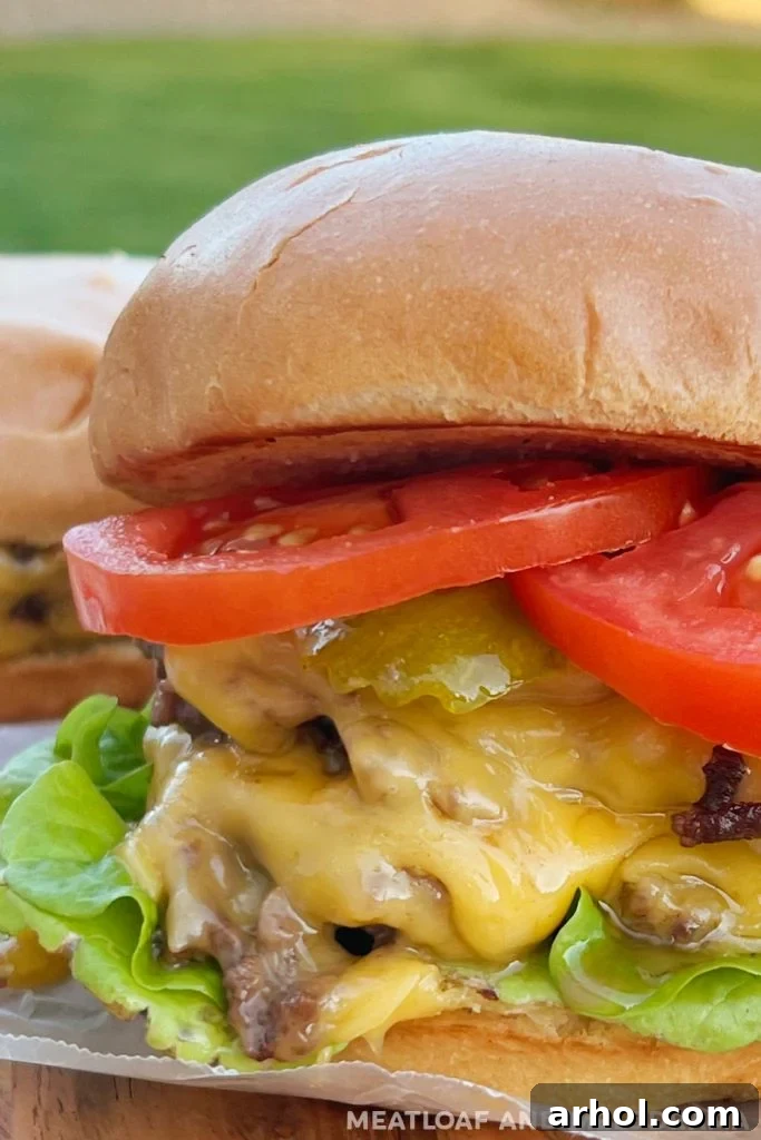 juicy blackstone double smash burger with melted cheese, showcasing the perfectly toasted bun.