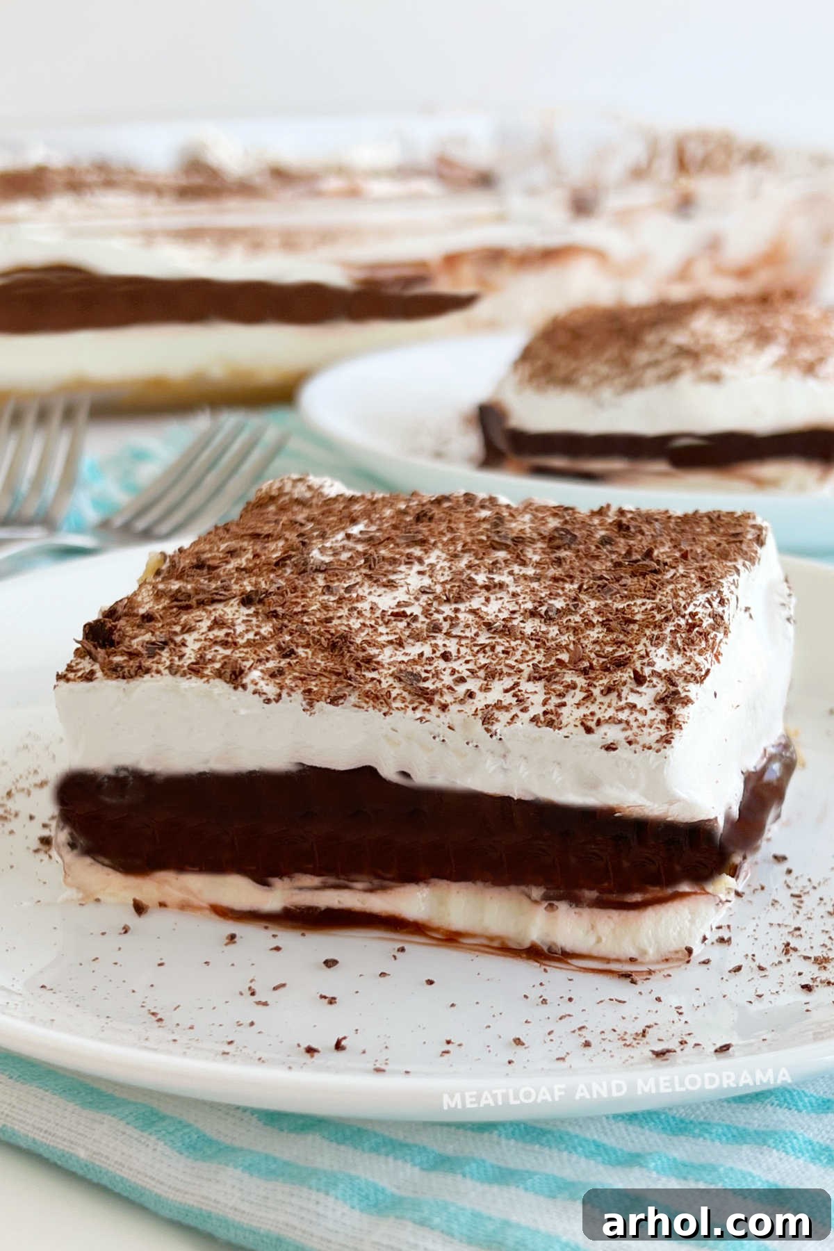 Slices of Grandma's layered chocolate delight dessert on a serving platter, ready to be enjoyed.
