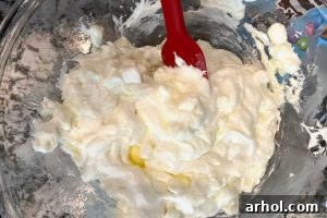 Melt butter and marshmallows in a bowl and stir until smooth.