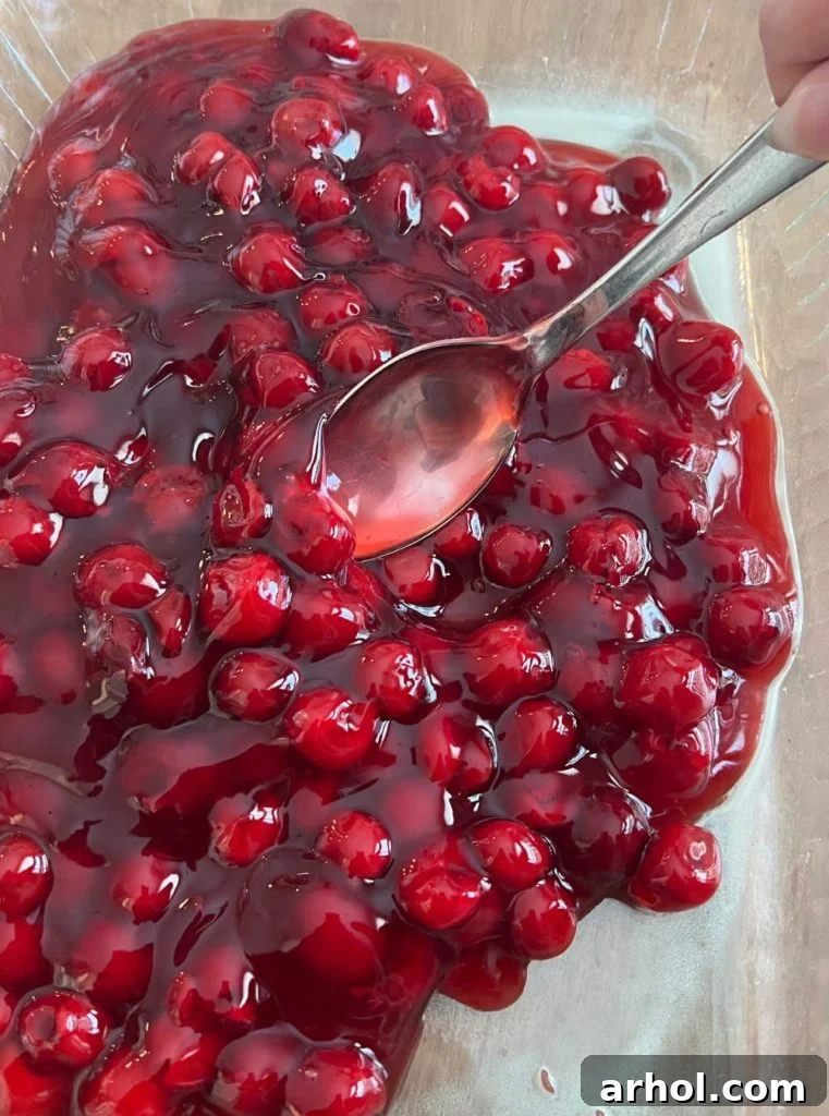 spread cherry pie filling in baking dish