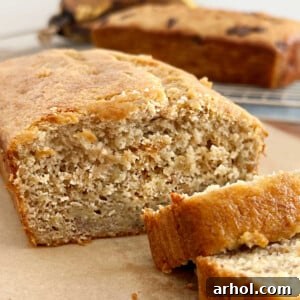 Loaf of cake mix banana bread sliced on the table, showcasing its tender crumb.