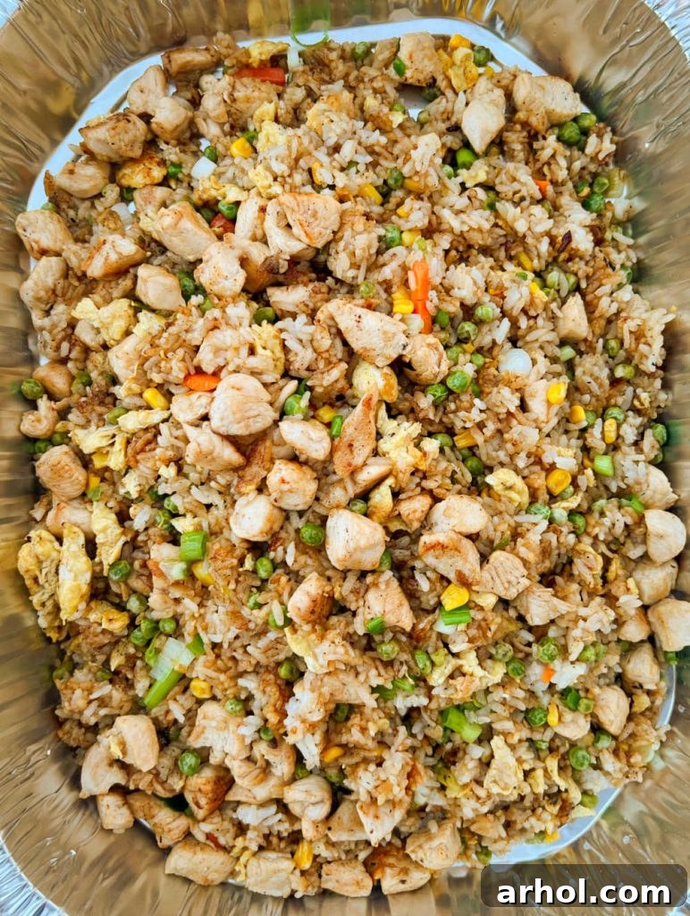 pan of chicken fried rice cooked on blackstone, ready to serve