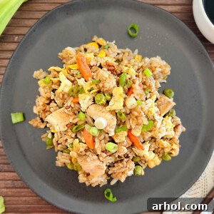 blackstone chicken fried rice with egg and vegetables on a plate