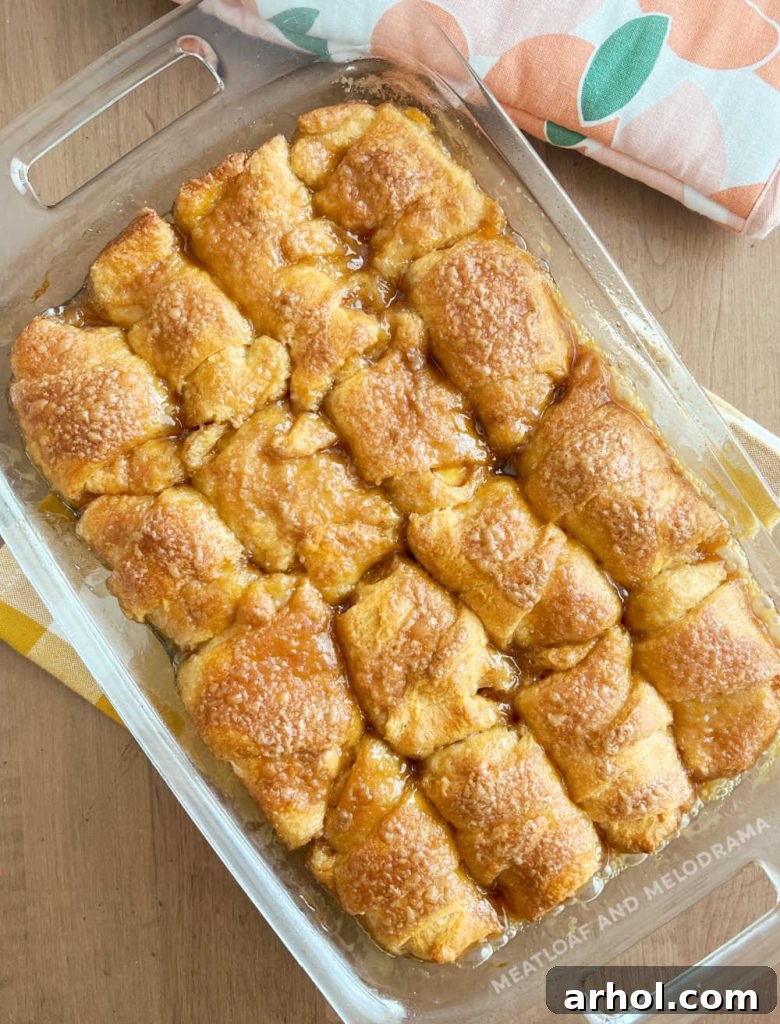 baked peach dumpling crescent rolls in baking dish