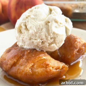 crescent roll peach dumplings with scoop of vanilla ice cream