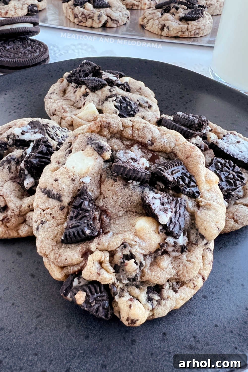 Close up shot of several Oreo Chocolate Chip Cookies arranged on a plate, highlighting their texture and ingredients.