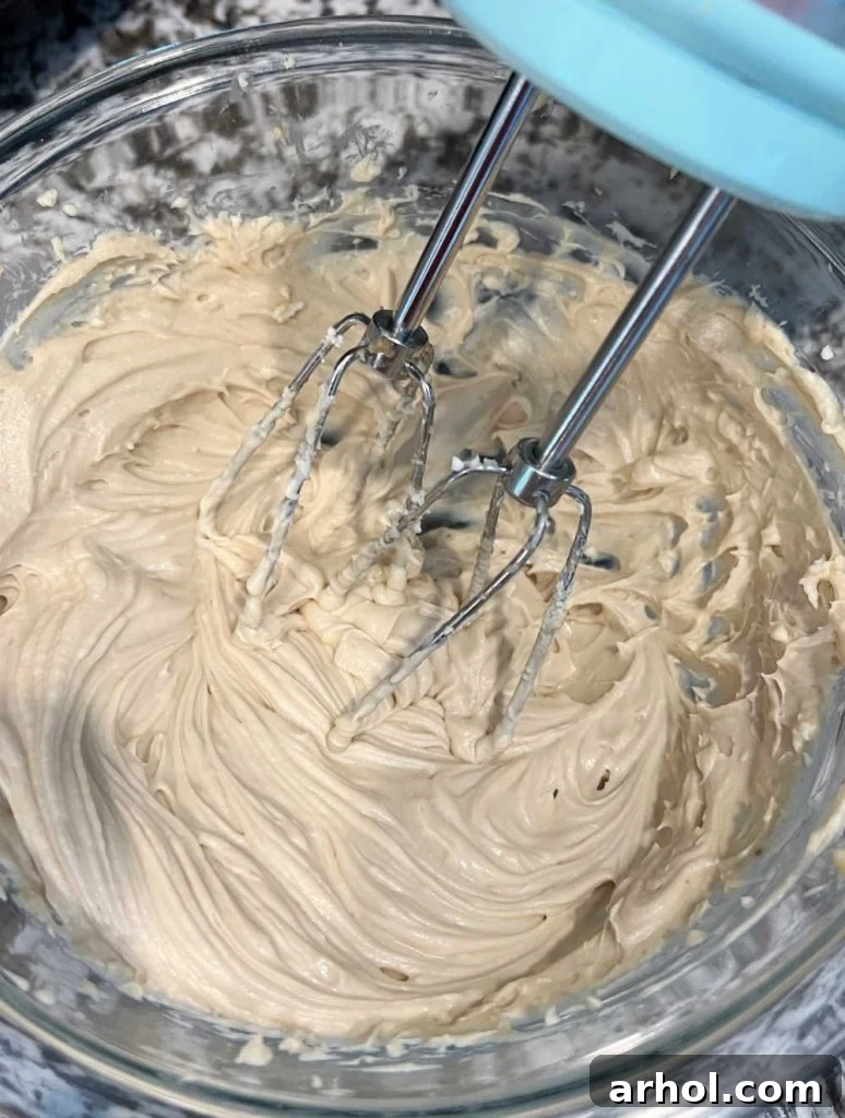 mix cream cheese, brown sugar and vanilla in mixing bowl