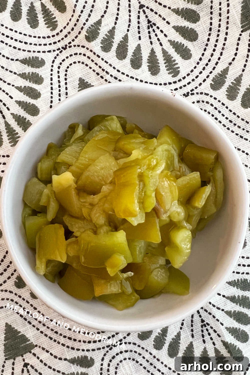 A bowl filled with freshly diced homemade roasted Hatch chiles, ready for use or storage.