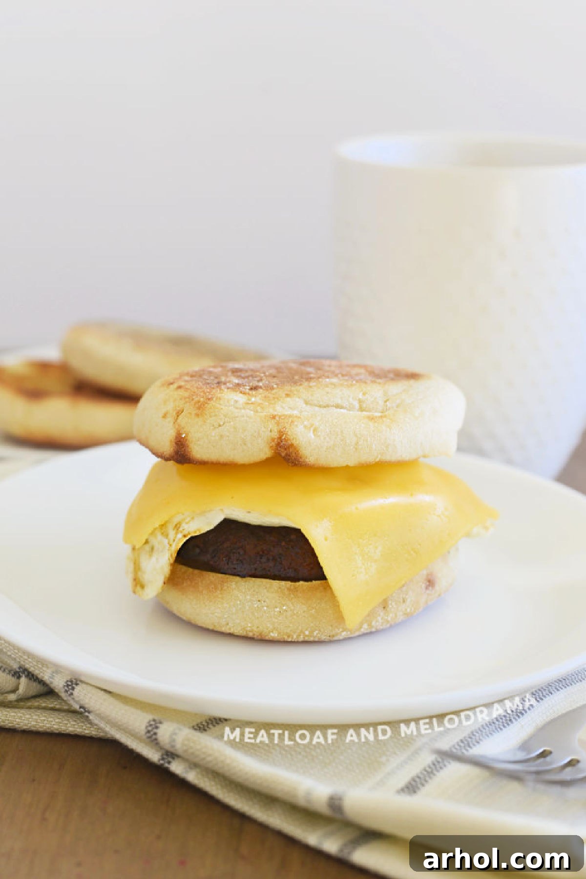 Golden Sausage Egg Cheese Sandwich 2 Sausage, Egg, and Cheese Breakfast Sandwich on an English Muffin