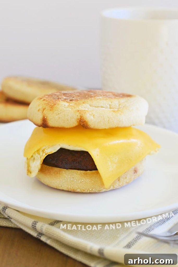 Golden Sausage Egg Cheese Sandwich 5 Homemade Sausage Egg and Cheese Breakfast Sandwich on a table, perfectly assembled