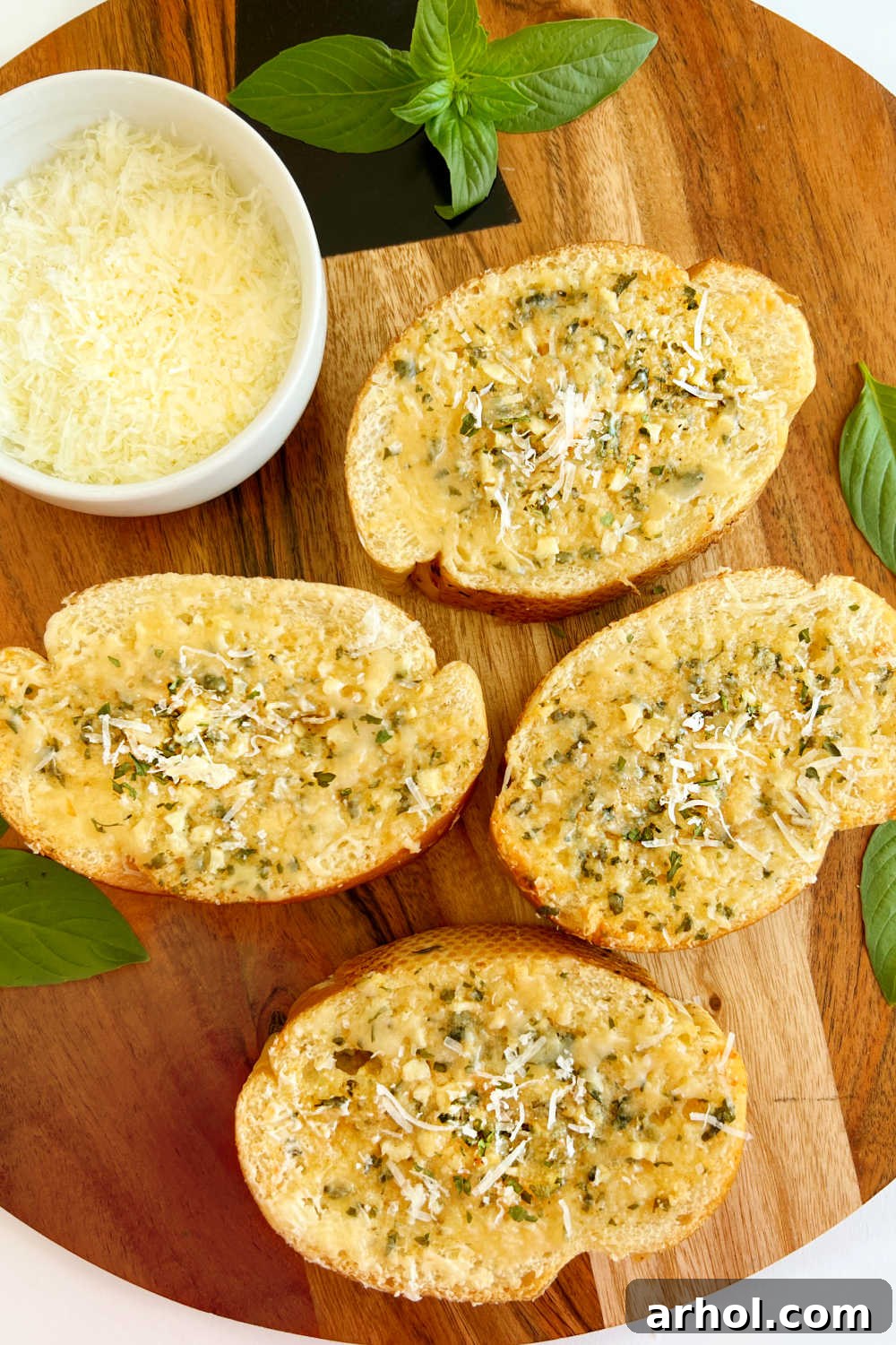 Homemade garlic bread slices from French bread with Parmesan cheese