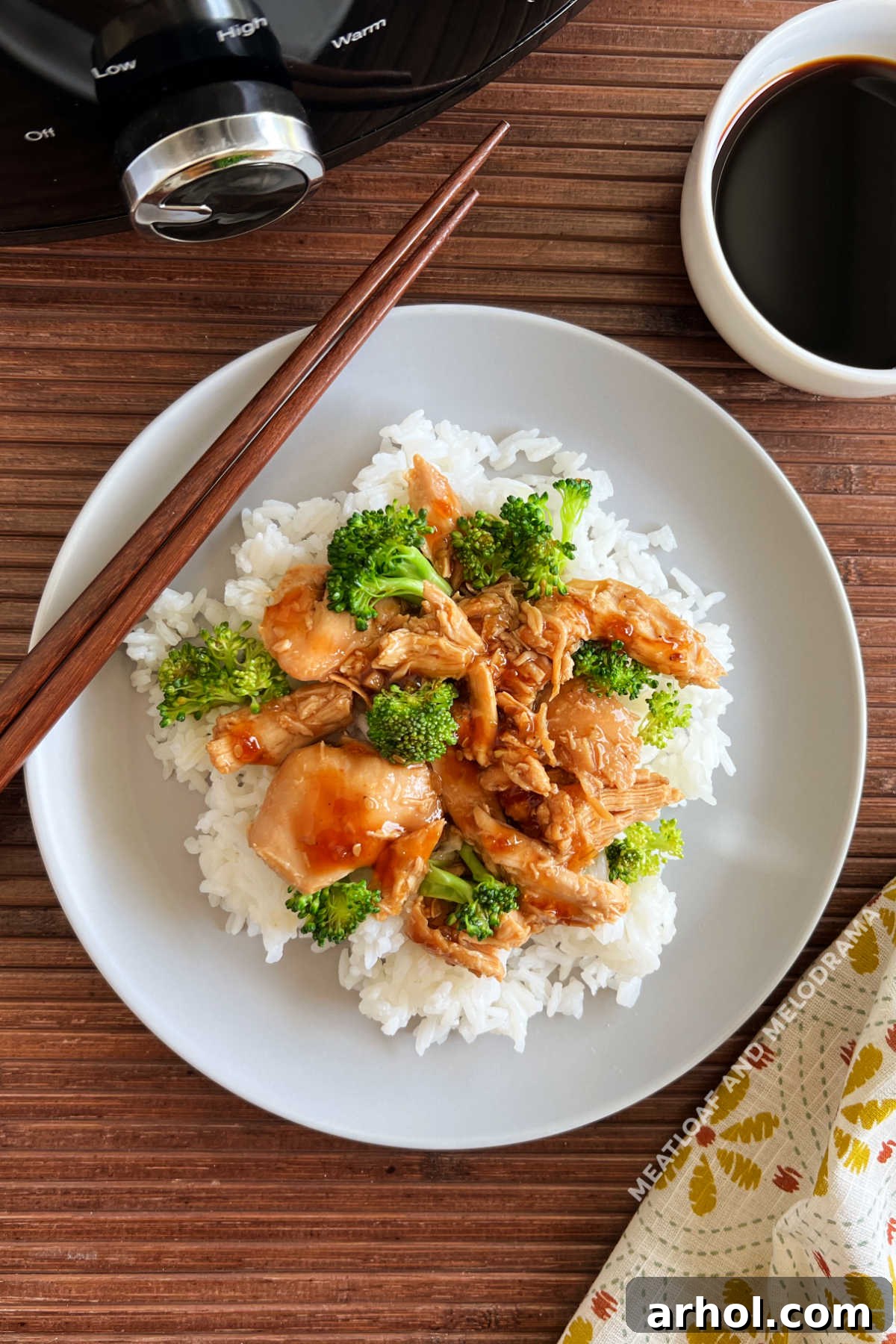Slow cooker teriyaki chicken with broccoli and bottled sauce served over rice