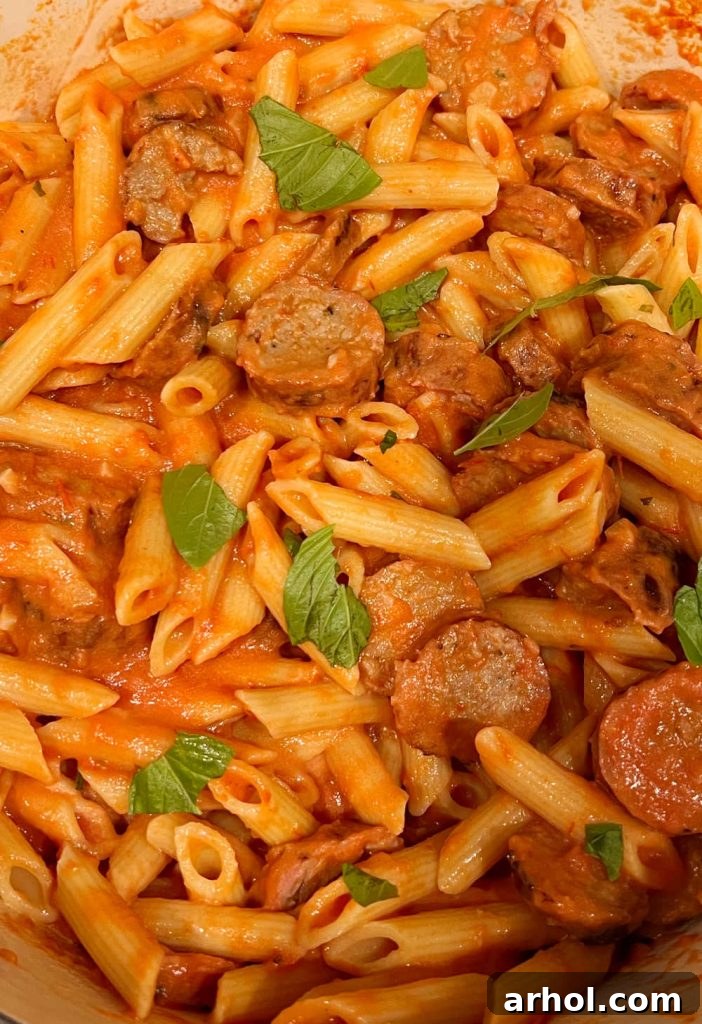 Penne alla Vodka with Italian sausage and fresh basil, ready to serve.