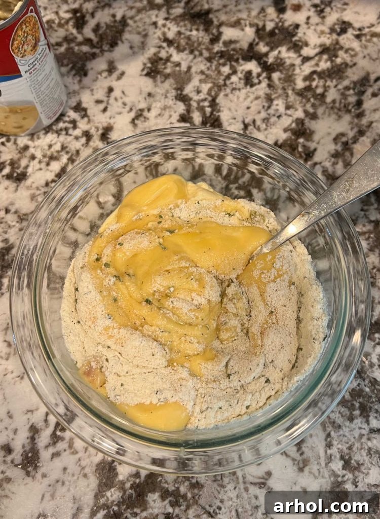 mix cream soups and ranch dressing mix in bowl
