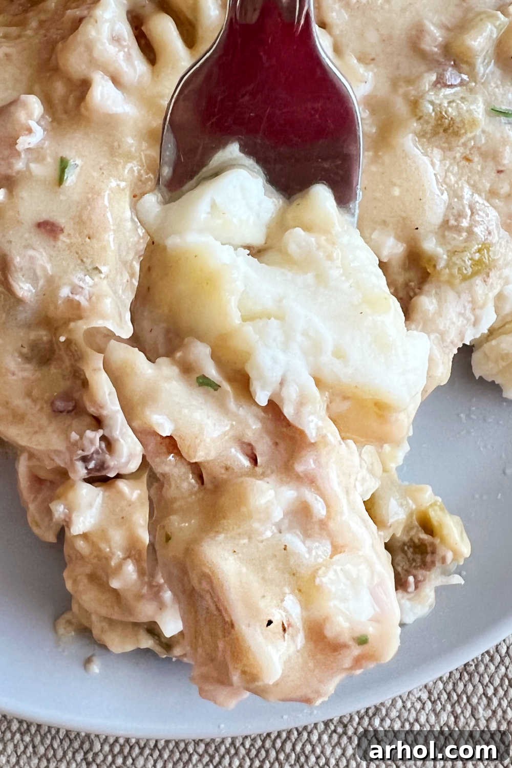 crockpot ranch pork chops and mashed potatoes on fork