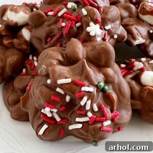 crockpot christmas candy peanut clusters with marshmallows and sprinkles