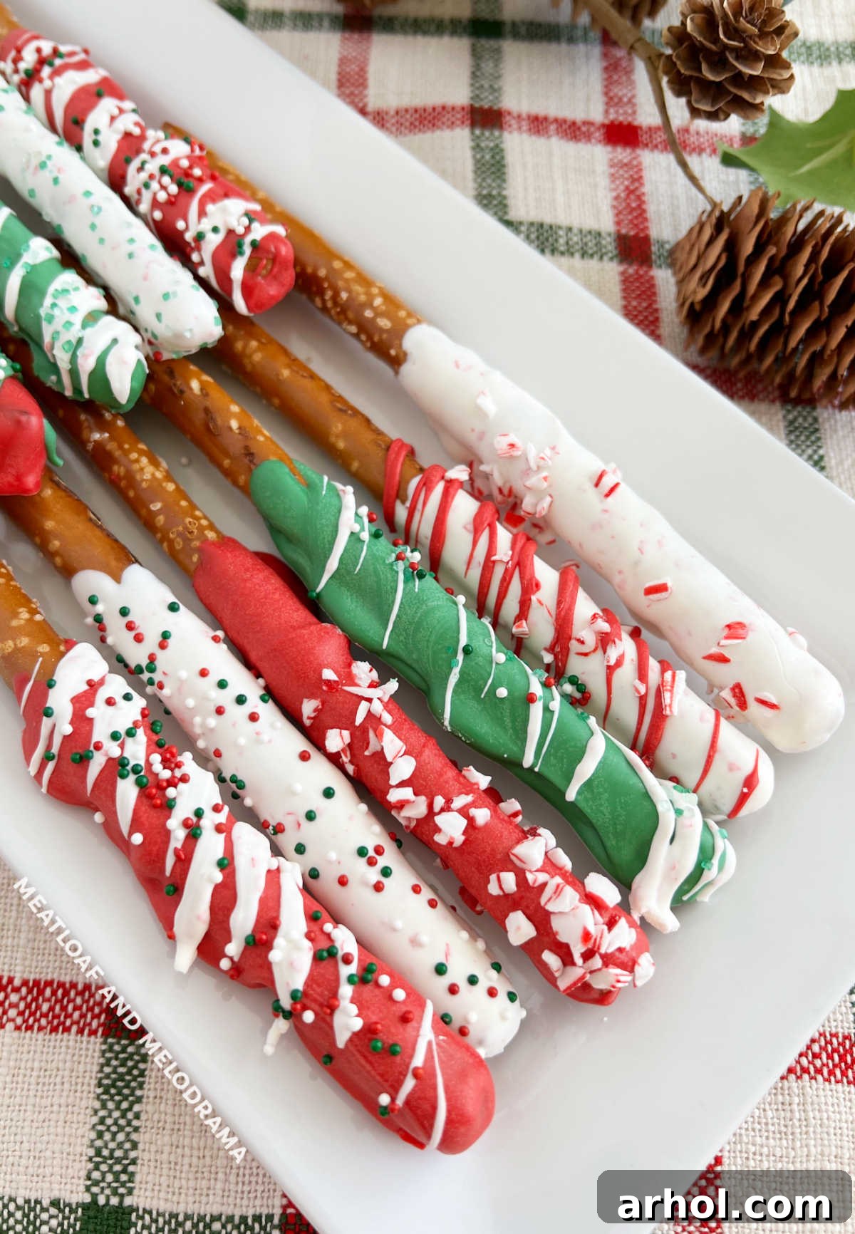 close up of chocolate covered Christmas pretzels with red and green sprinkles, ready to be enjoyed