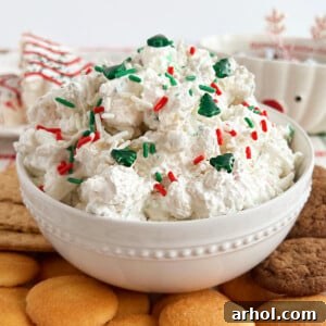 little Debbie Christmas tree cake dip with sprinkles and graham crackers on table