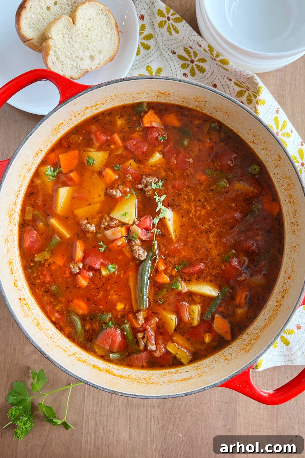 Comforting Ground Beef and Veggie Soup 2 Hearty vegetable beef soup with ground beef and fresh vegetables simmering in a large Dutch oven