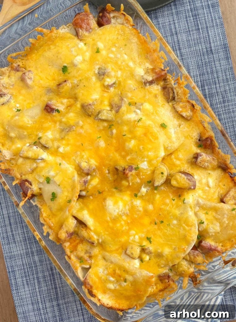 baked pierogi casserole with cheddar cheese in baking dish
