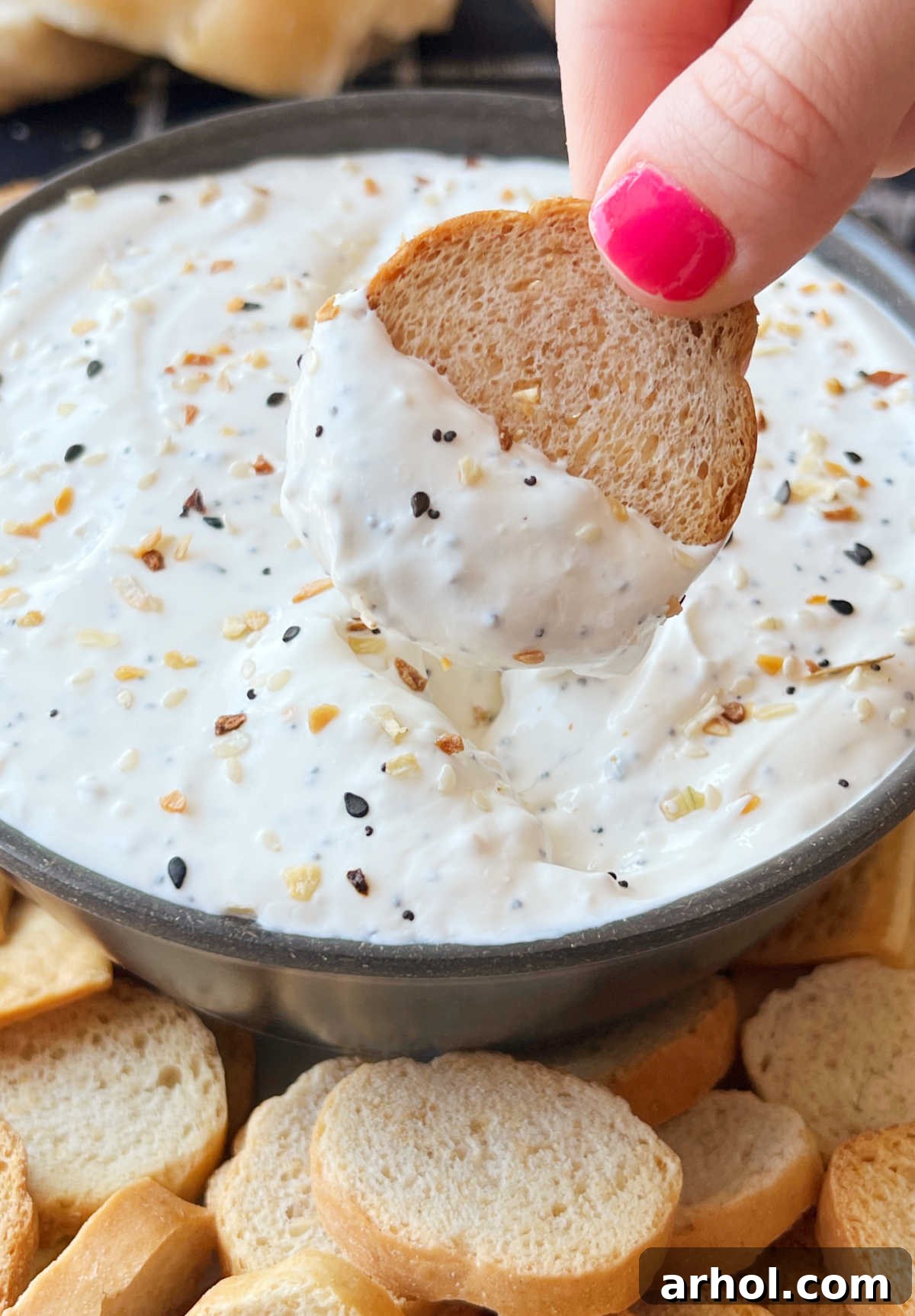 Homemade Everything Bagel Dip served with crispy bagel chips, ready to be enjoyed.