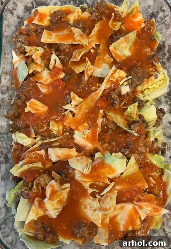 Layer meat mixture and cabbage with tomato soup in casserole dish