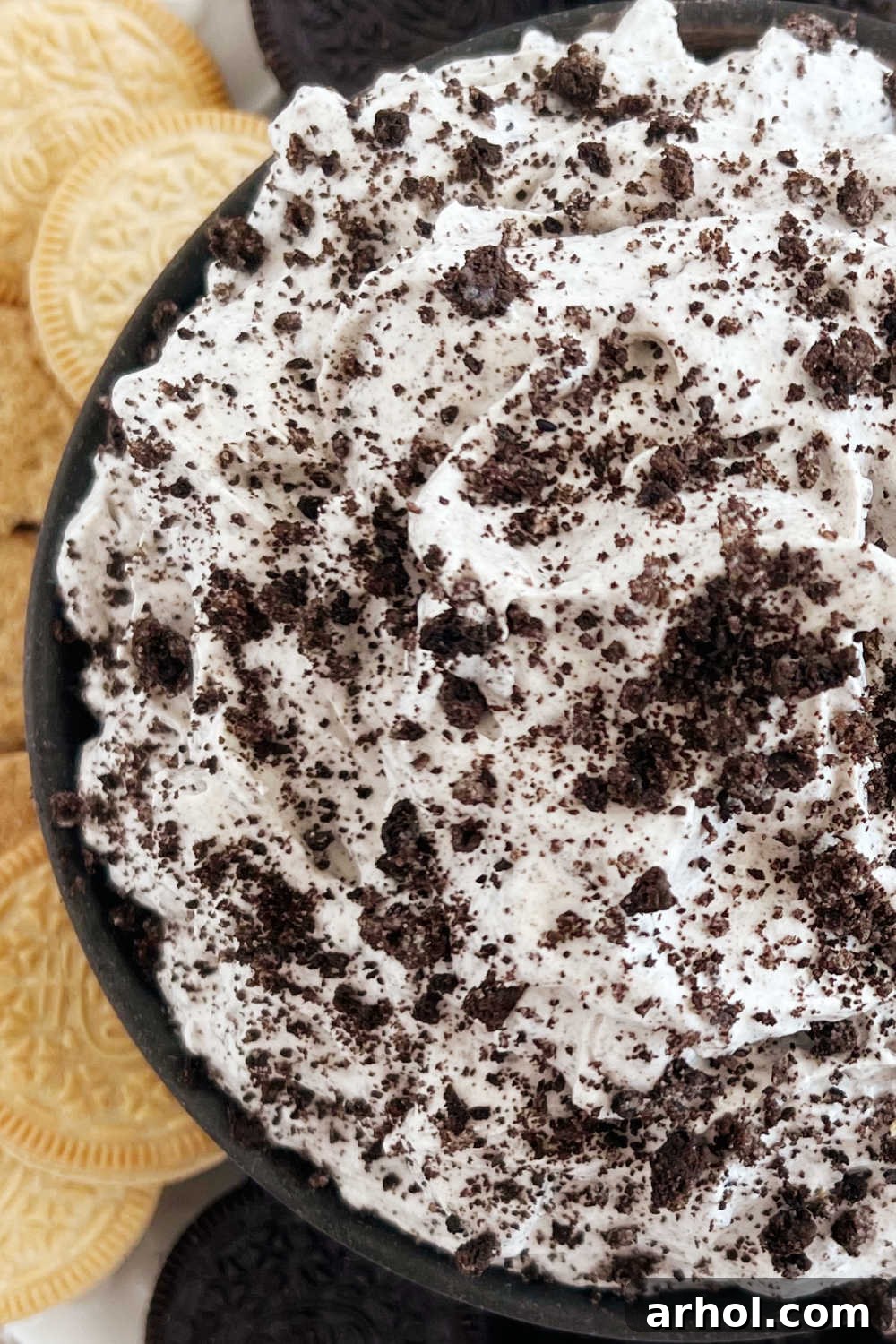 close up of oreo dip with crushed oreo cookies on top