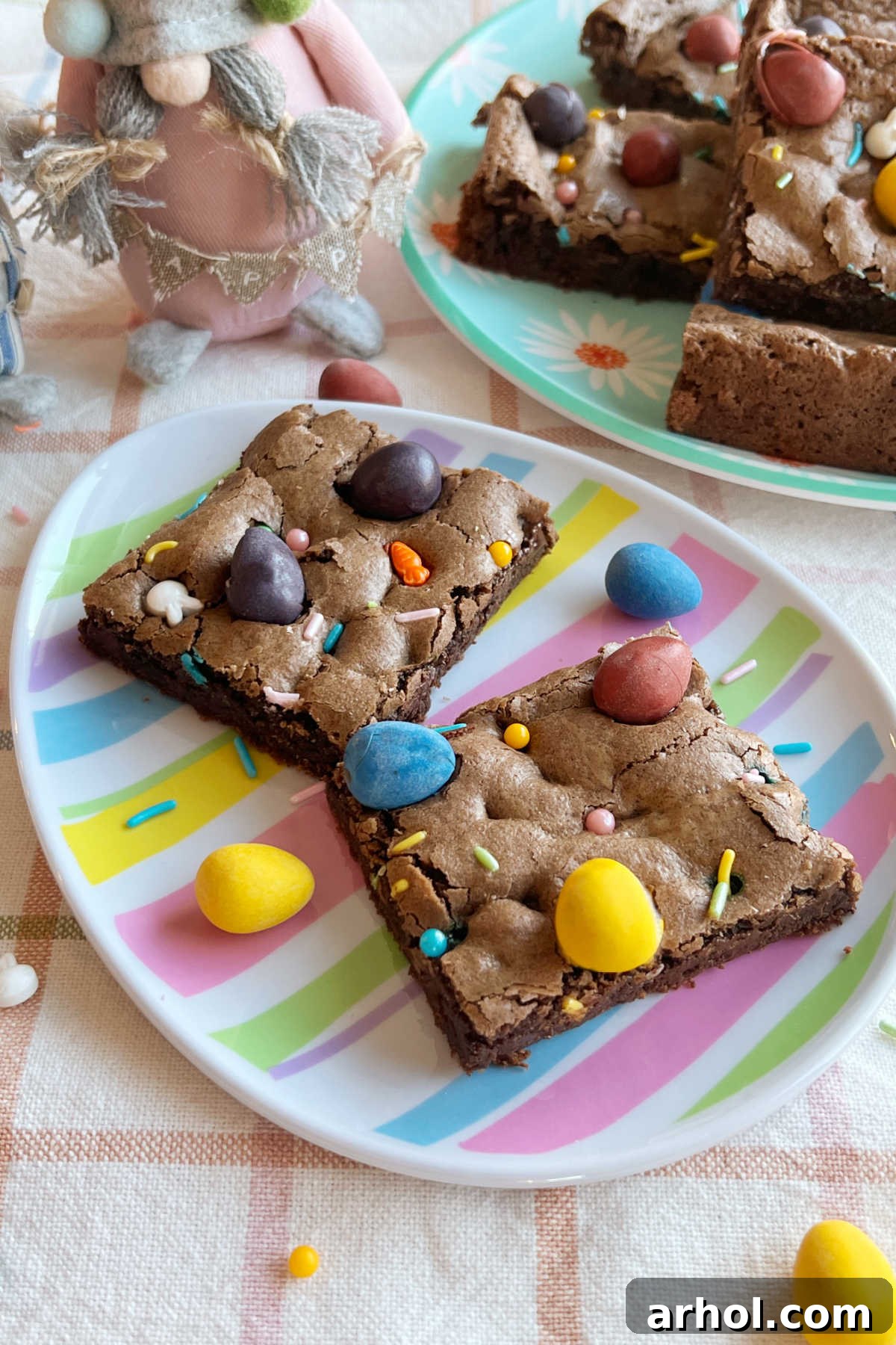 Mini Egg Magic Brownies 8 A festive Easter table setting with charming Easter gnomes, accompanied by a tray of delicious Easter egg brownies.