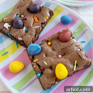 Easter brownies with Cadbury mini eggs and sprinkles on top, in a square format for recipe card.