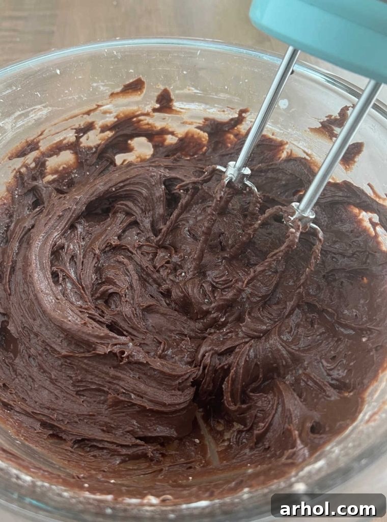 mix cream cheese and brownie mix with electric mixer