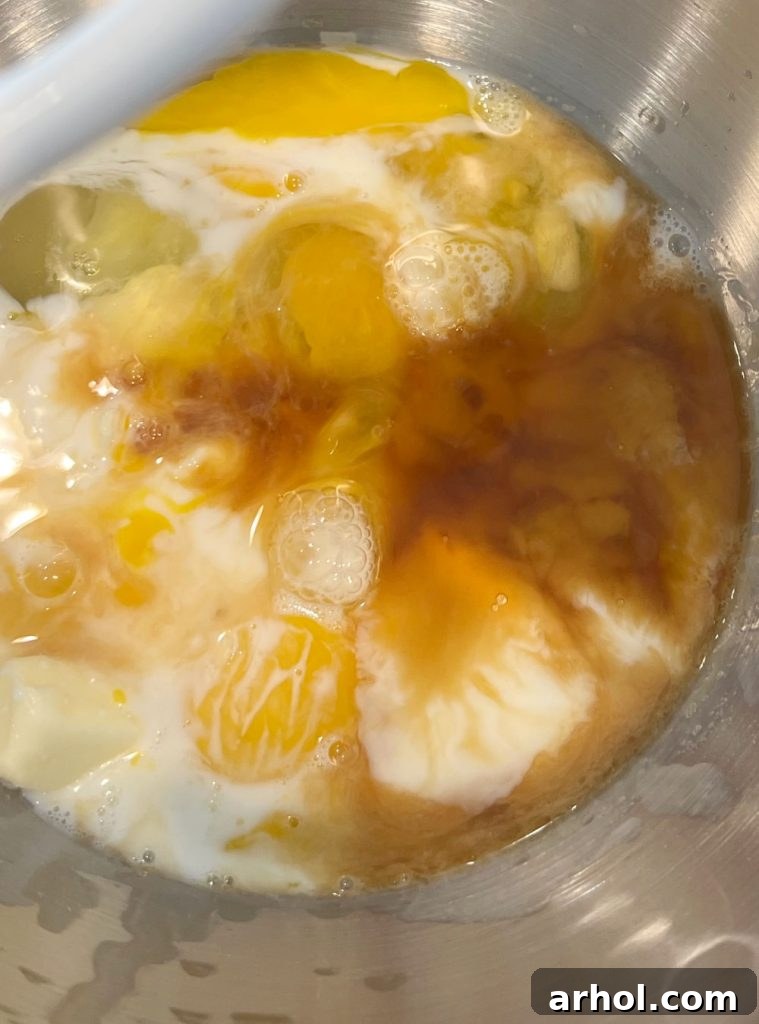 mix milk, butter and eggs in large bowl of stand mixer