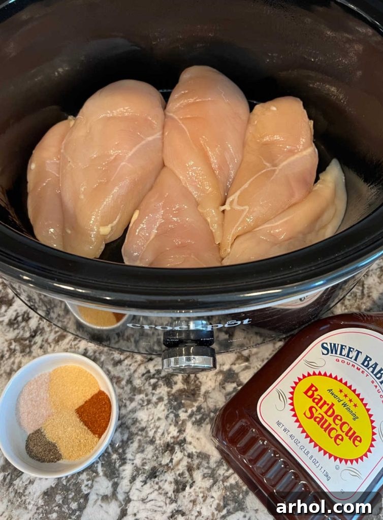 Irresistible Slow Cooker BBQ Pulled Chicken 3 boneless chicken, BBQ sauce and seasonings