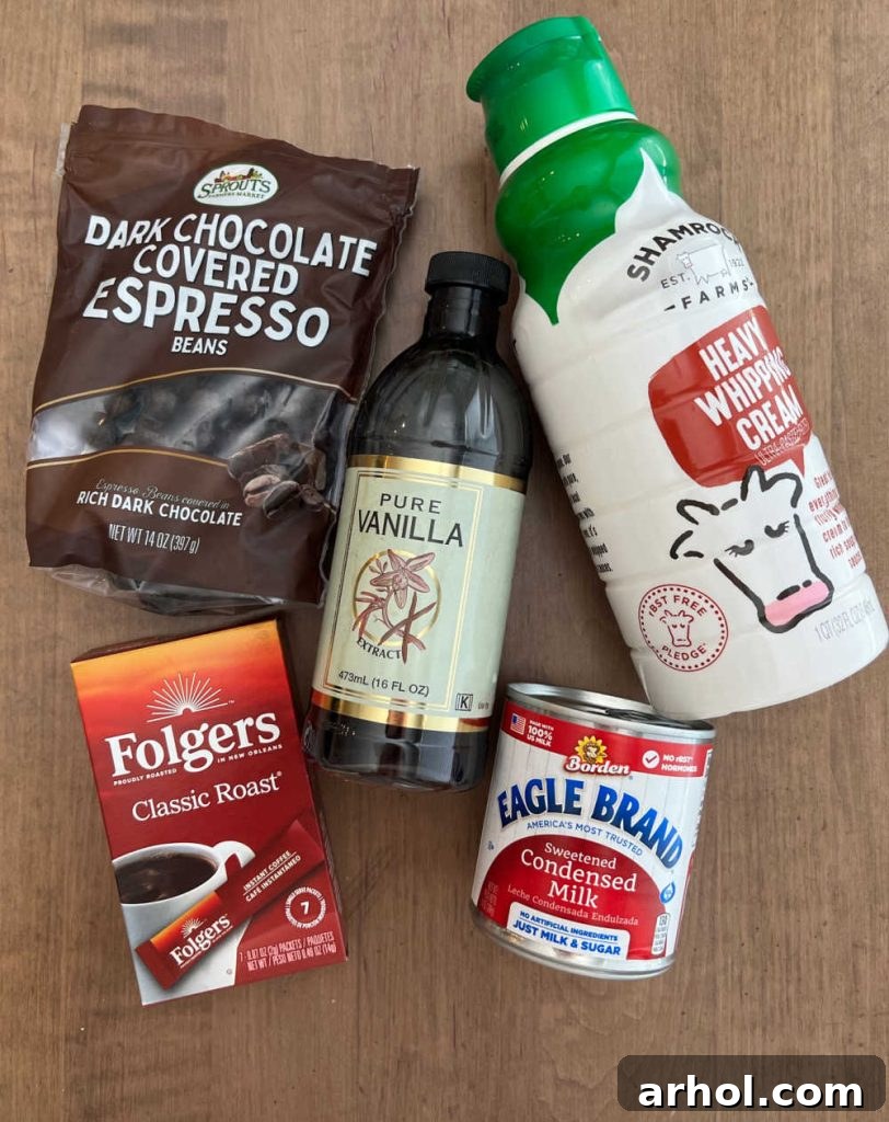 Instant coffee, heavy whipping cream, sweetened condensed milk, vanilla extract, and chocolate covered espresso beans.