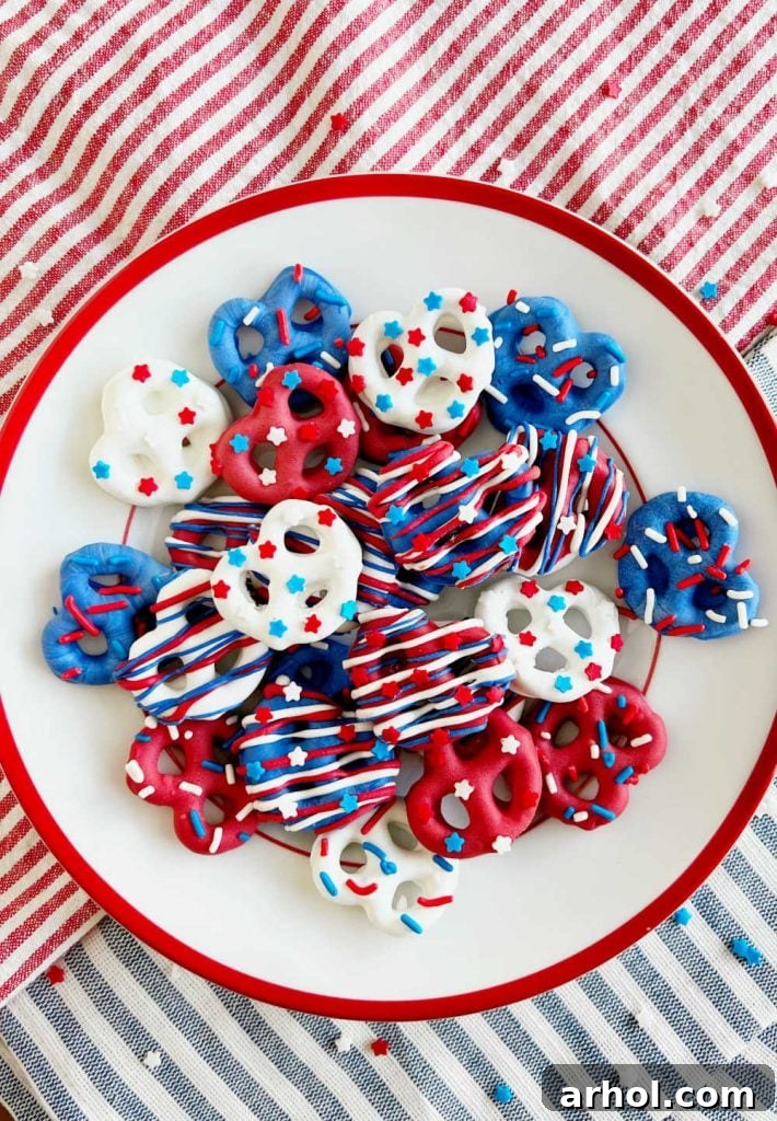 Patriotic pretzels with star sprinkles arranged beautifully on a Fourth of July table, ready for serving.