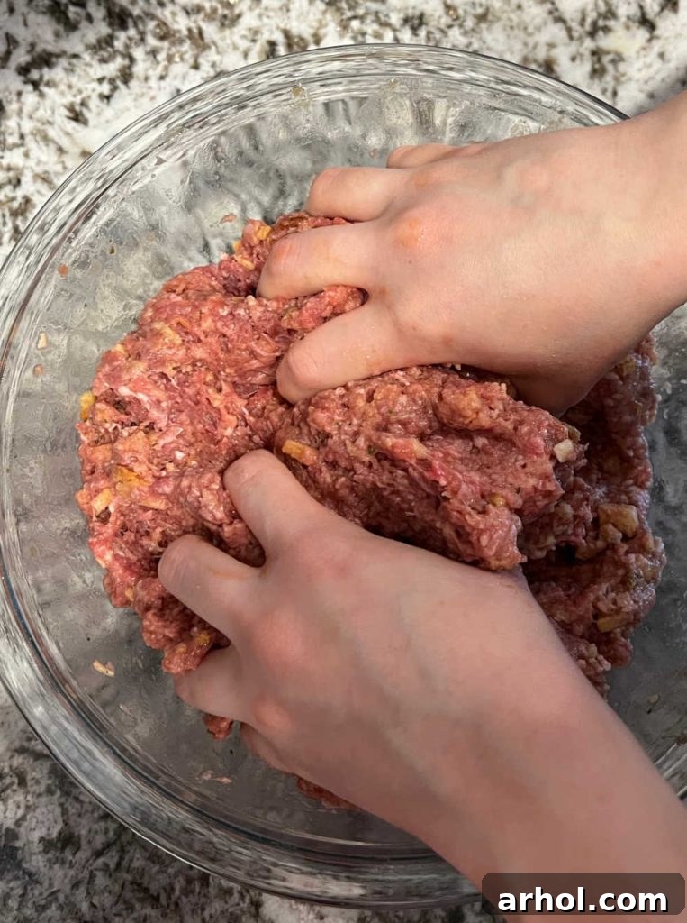 mix meatloaf mixture with hands in large mixing bowl.