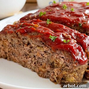 stove top stuffing meatloaf with ketchup glaze sliced on platter.