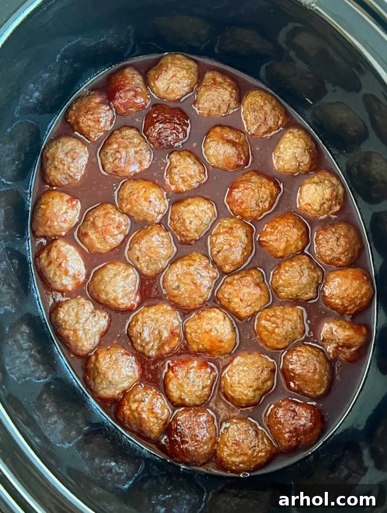 meatballs with grape jelly and chili sauce in crockpot